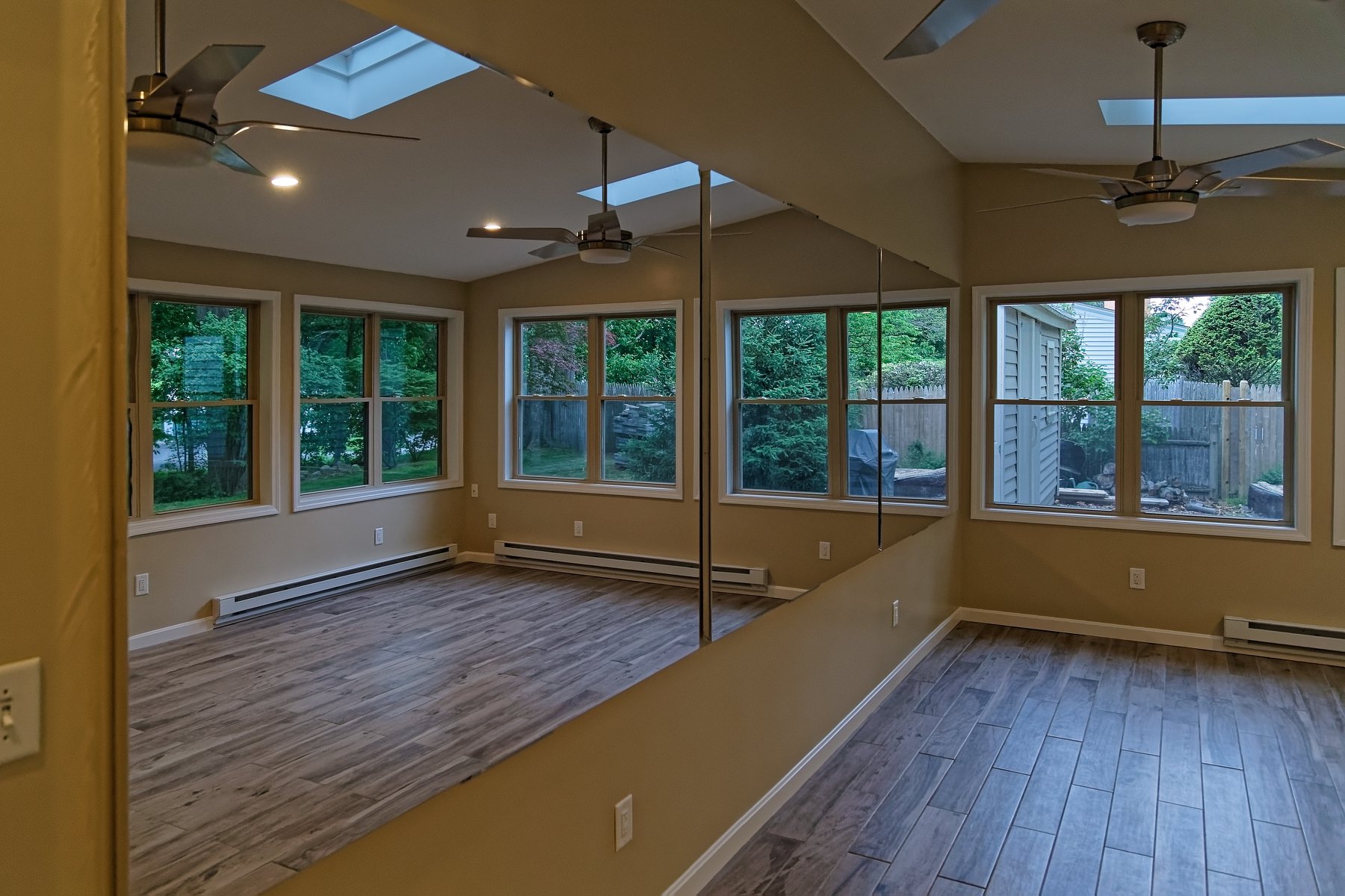 Wall mounted glassless mirrors installed in a professional dance studio